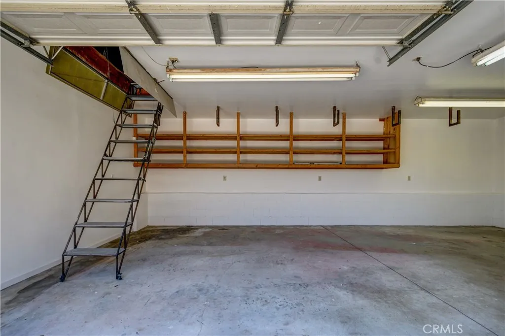 Remote control stairs to upper storage level of garage/workshop Remote control stairs to upper storage level of garage/workshop
