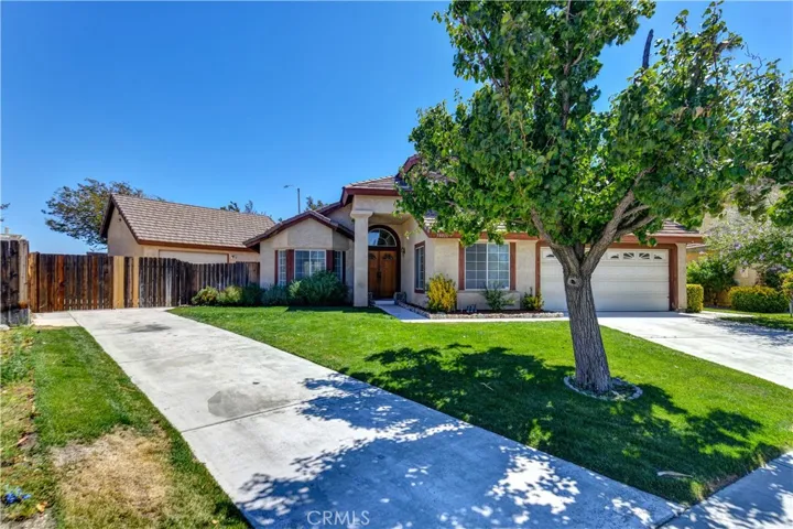 Front of home with separate driveway to RV parking and workshop/garage