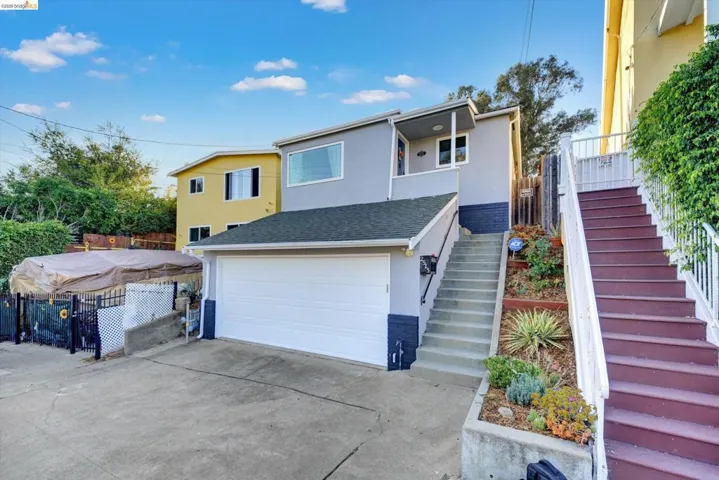 Attached garage with a white door