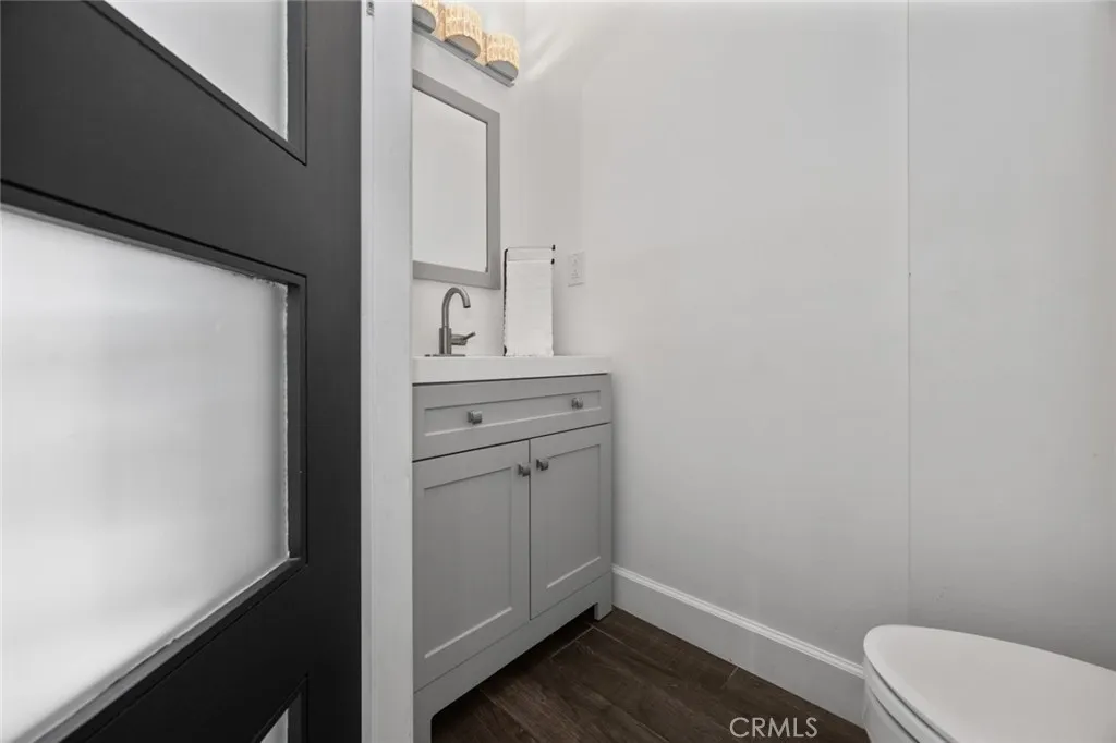 Half bath is located in the den area. Half bath is located in the den area.