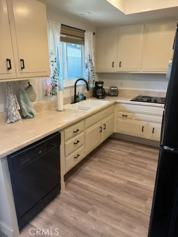 Kitchen has a dishwasher and microwave
