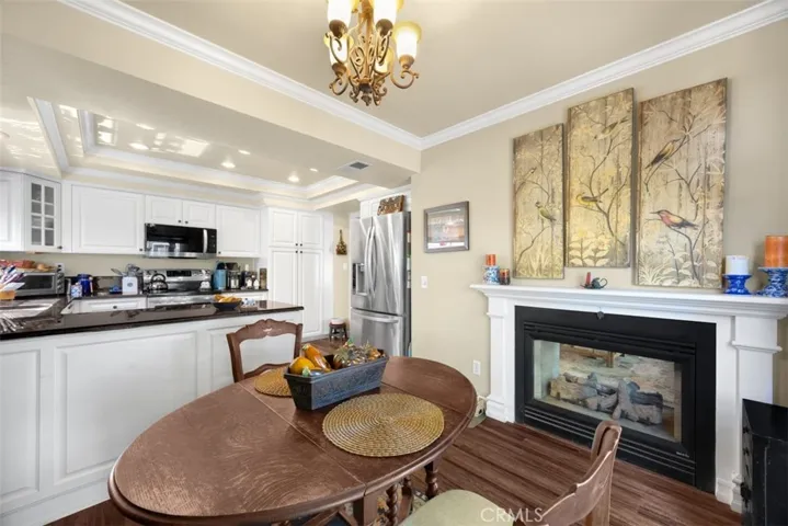 Double sided fireplace open to kitchen nook