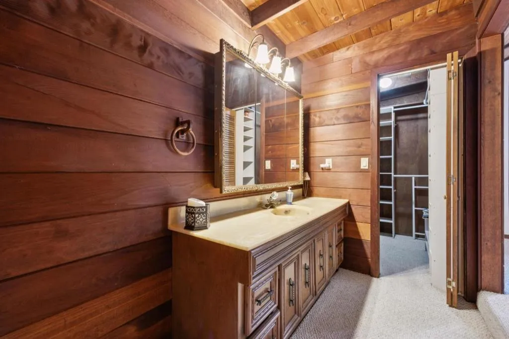 Primary bathroom vanity and walk-in closet Primary bathroom vanity and walk-in closet