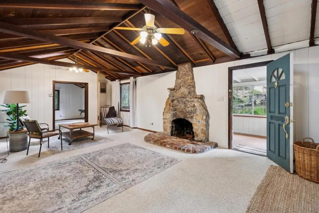 Beautiful stone fireplace in living room Beautiful stone fireplace in living room