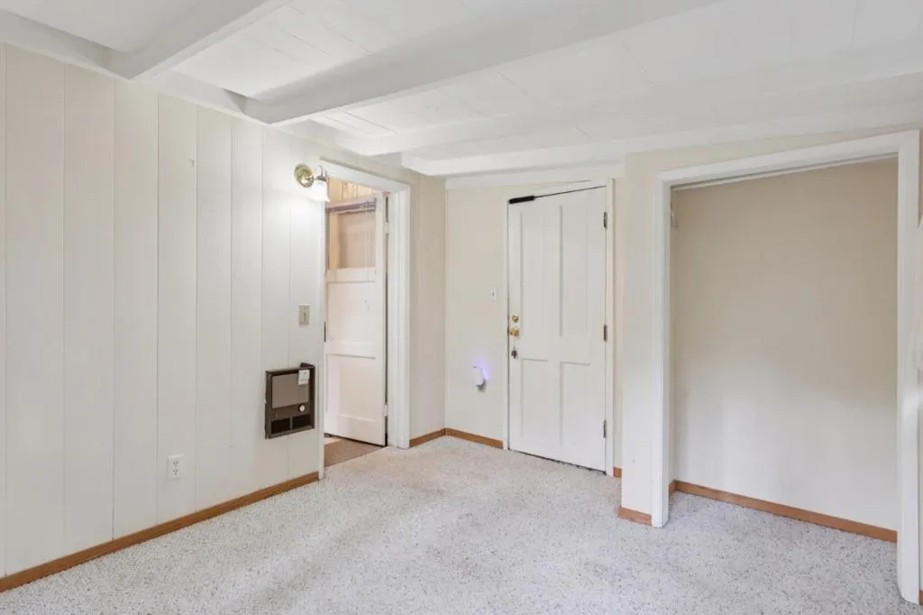 Bedroom 1: view of door to side porch and front yard plus closet area Bedroom 1: view of door to side porch and front yard plus closet area