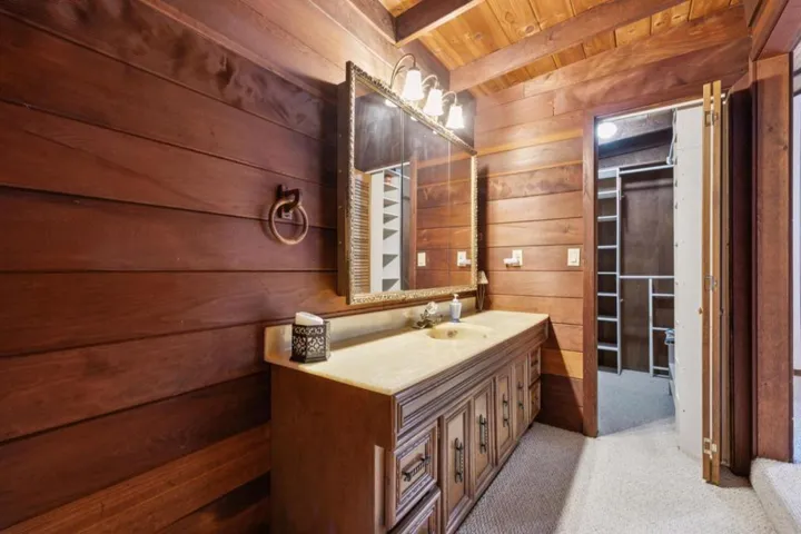 Primary bathroom vanity and walk-in closet
