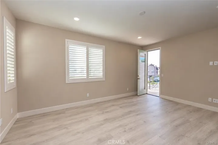 Primary Bedroom with balcony access