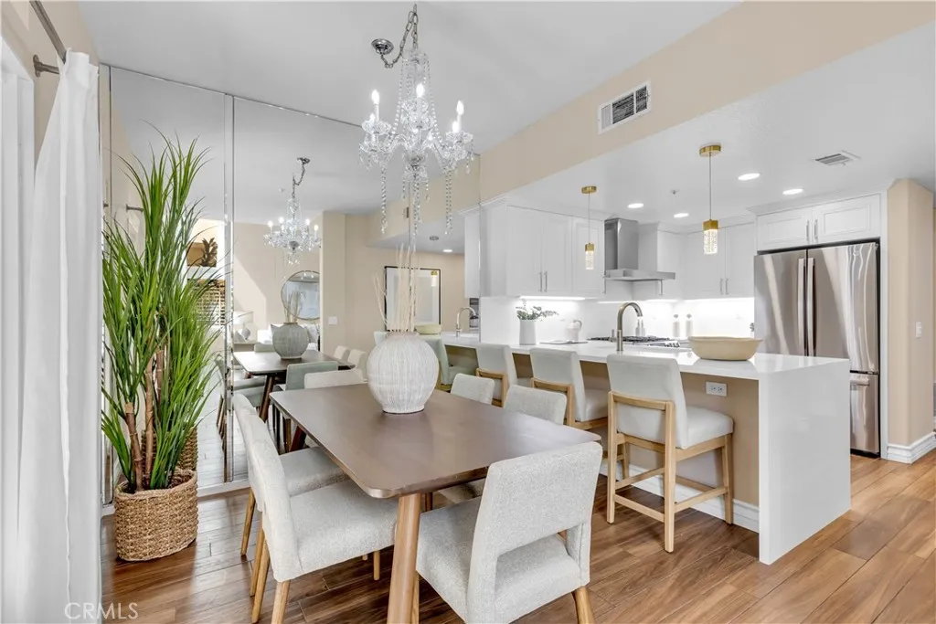 The dining room is very spacious with plenty of space for a large table as well as barstool seating at the kitchen.
