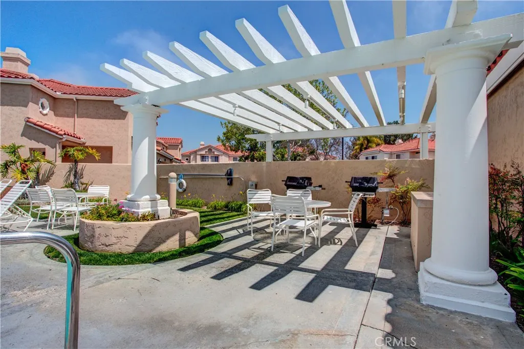 The bbq area in the pool courtyard.