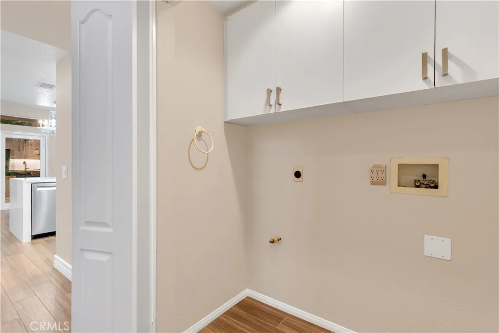 The laundry closet is downstairs and has connections for both gas and electric appliances.