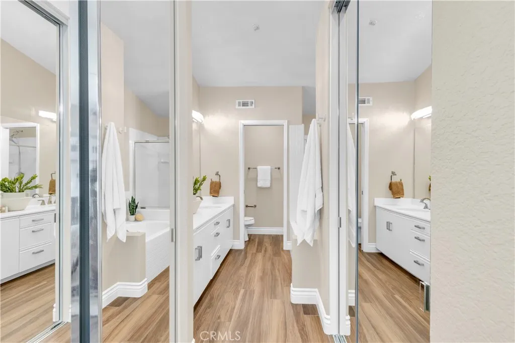 The primary bathroom has dual mirrored closets.