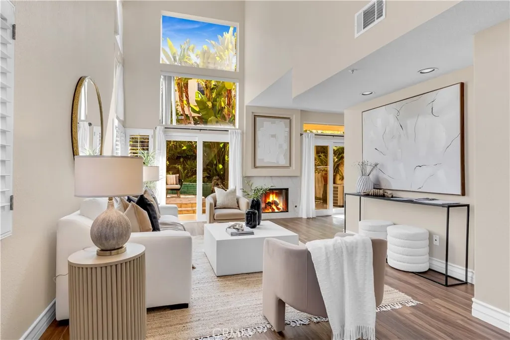 The living room as well as the dining room have dual pane sliding glass doors leading to your backyard.