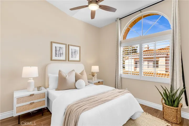 The upstairs guest bedroom has vaulted ceilings and plenty of natural light.