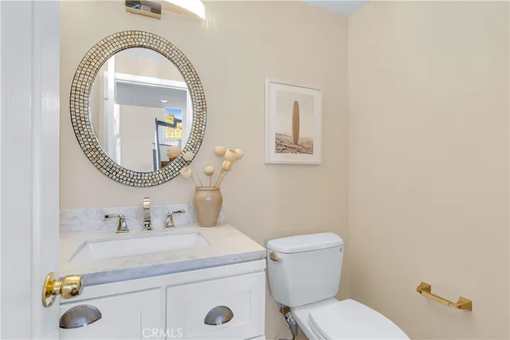 The downstairs half bathroom also has an upgraded vanity area.
