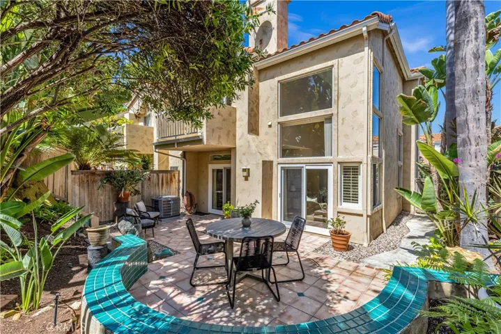The backyard has dual patio seating areas.