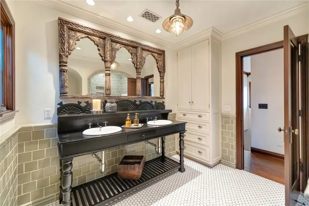 2nd floor Hall bathroom is unique with hand made sink cabinetry and mirror