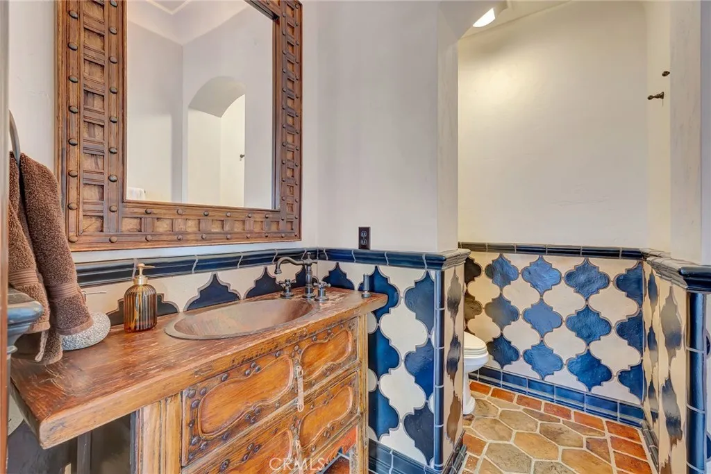 Pool 1/2 bathroom with Ken Mason tile wainscoting