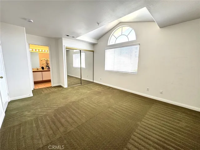 Primary Bedroom with Vaulted Ceiling