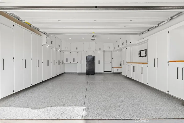 custom garage with epoxy and built in cabinets