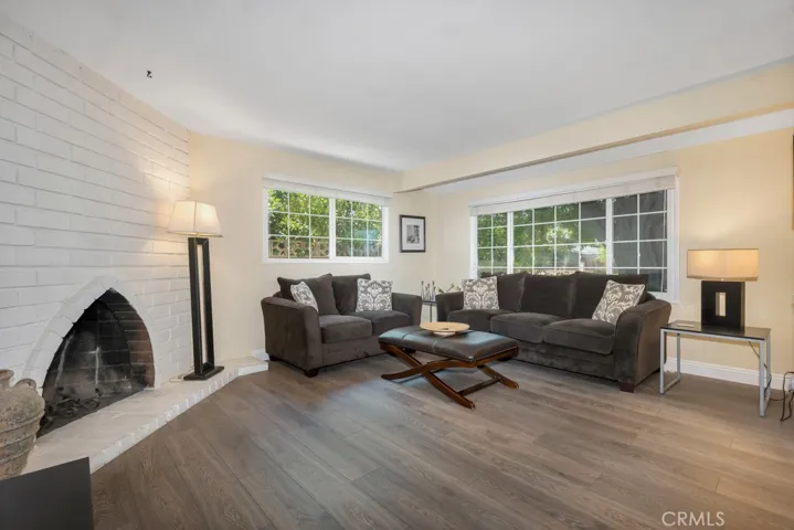 Light-Filled Living Room with White Brick Fireplace