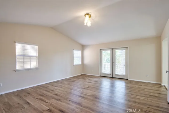 PRIMARY BEDROOM FRENCH DOOR TO DECK