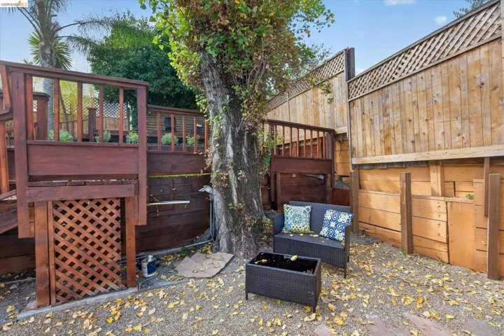 Multi-level wood decking with lattice accents and a wood privacy fence with lattice top