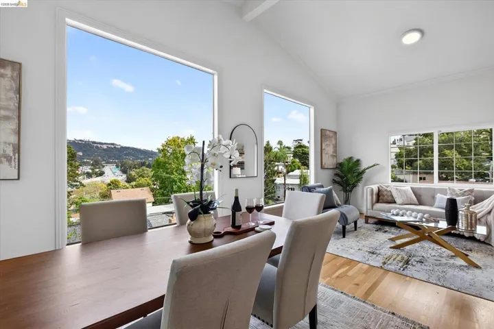 Vaulted ceilings, expansive windows, recessed lighting, and wood-finish flooring
