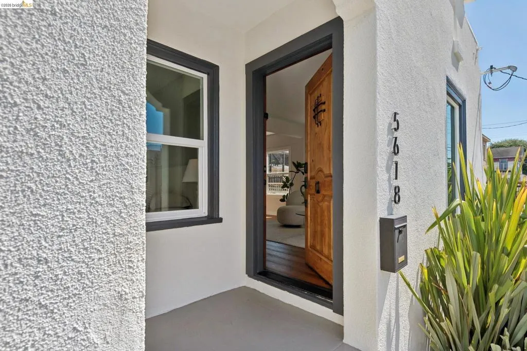 Textured stucco exterior with dark trim Textured stucco exterior with dark trim