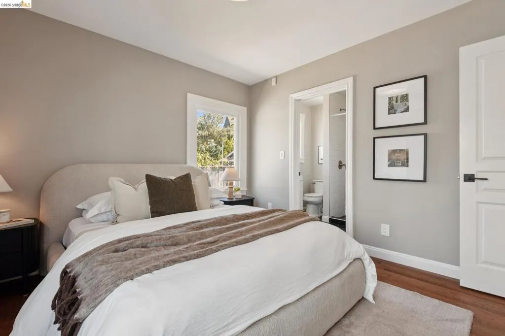 Hardwood flooring, white trim, recessed lighting, and a white paneled door with black hardware Hardwood flooring, white trim, recessed lighting, and a white paneled door with black hardware