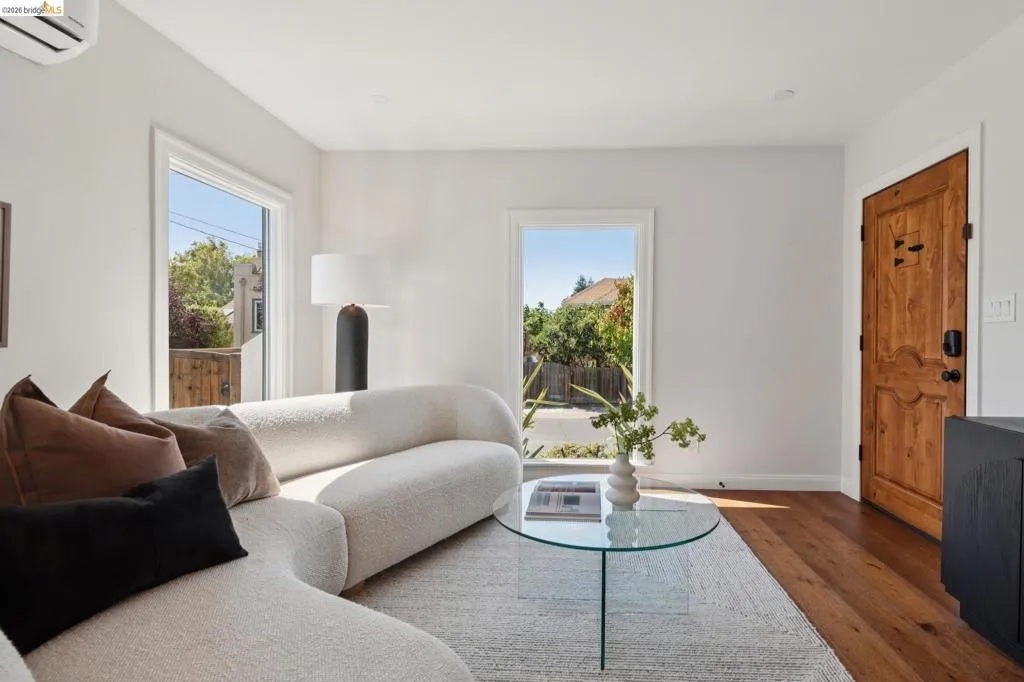 Hardwood flooring, white walls, and bright window frames Hardwood flooring, white walls, and bright window frames