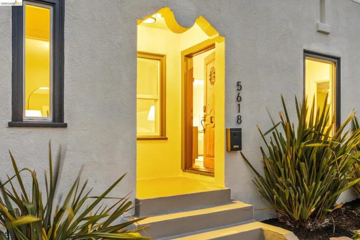 Stucco exterior with dark-trimmed windows