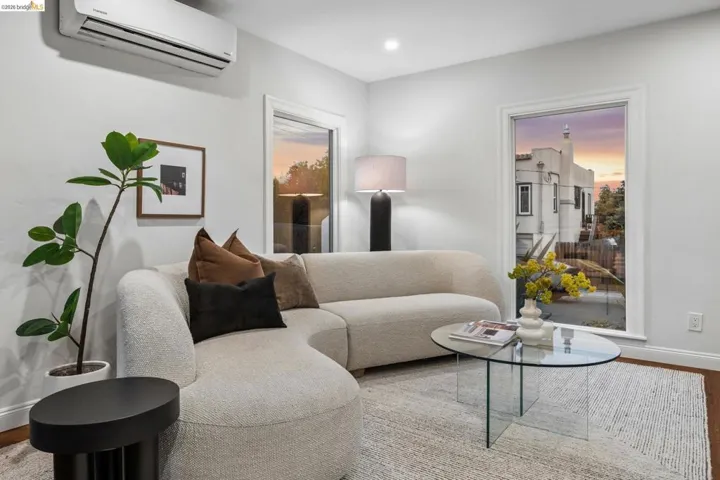 Recessed lighting, wood-finish flooring, and white trim