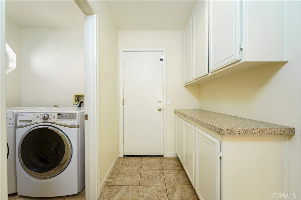 Garage door and ideal downstairs linen or back up pantry for those big grocery shopping days buying in multiples. Laundry is its own room, you do not need to walk thru it when you come in from the garage...LOVE THAT! It also has a huge laundry sink for extra dirty stuff or gentle hand washables. Garage door and ideal downstairs linen or back up pantry for those big grocery shopping days buying in multiples. Laundry is its own room, you do not need to walk thru it when you come in from the garage...LOVE THAT! It also has a huge laundry sink for extra dirty stuff or gentle hand washables.