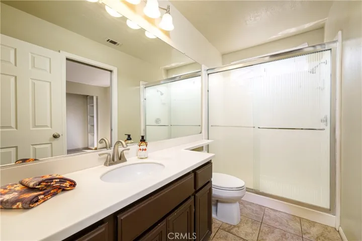 Downstairs full bath with a walk-in shower (not a tub)