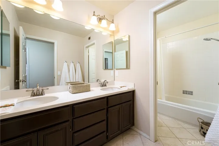 The upstairs hall bathroom is really large too! Double sinks and separate room for commode and tub/shower with a window.