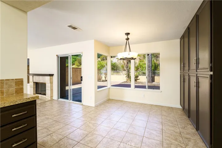 The huge kitchen nook is ideal for a large table. The gigantic pantry cabinets make food storage a breeze.