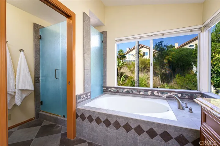 Large soaking tub and separate shower.