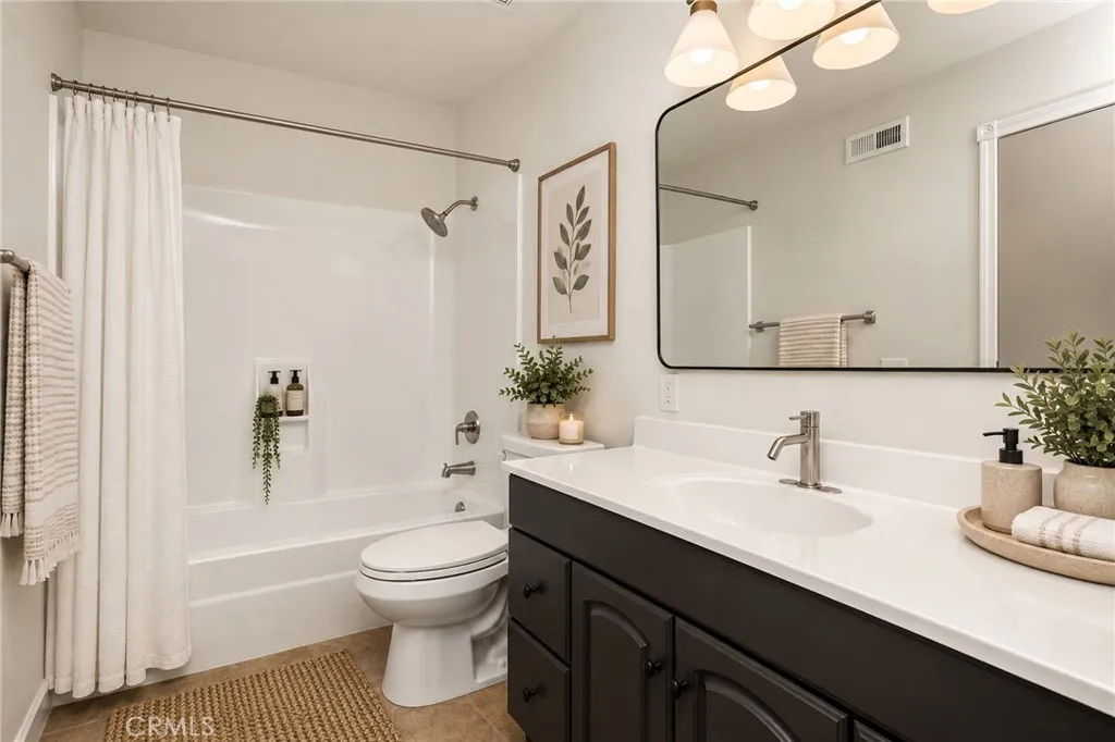 Virtually staged upstairs bathroom in primary. Virtually staged upstairs bathroom in primary.