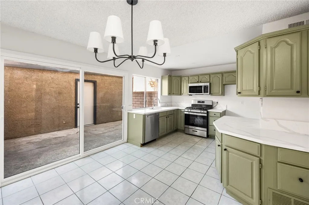 Kitchen, dining & patio view. Kitchen, dining & patio view.