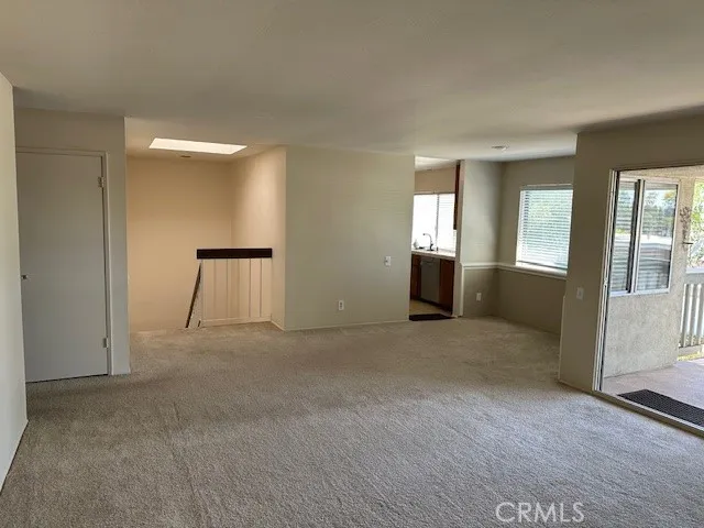 Large family room, designated dining area and spacious fully covered patio.