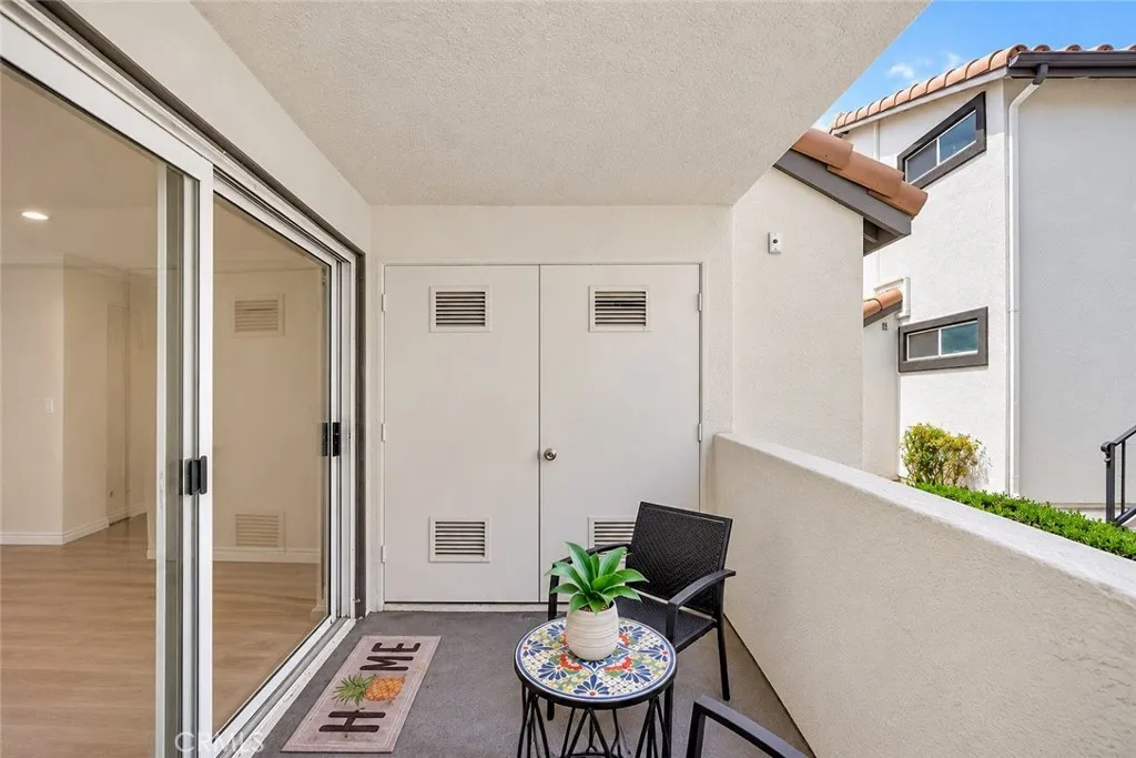 Private patio with stacked washer/dryer in closet