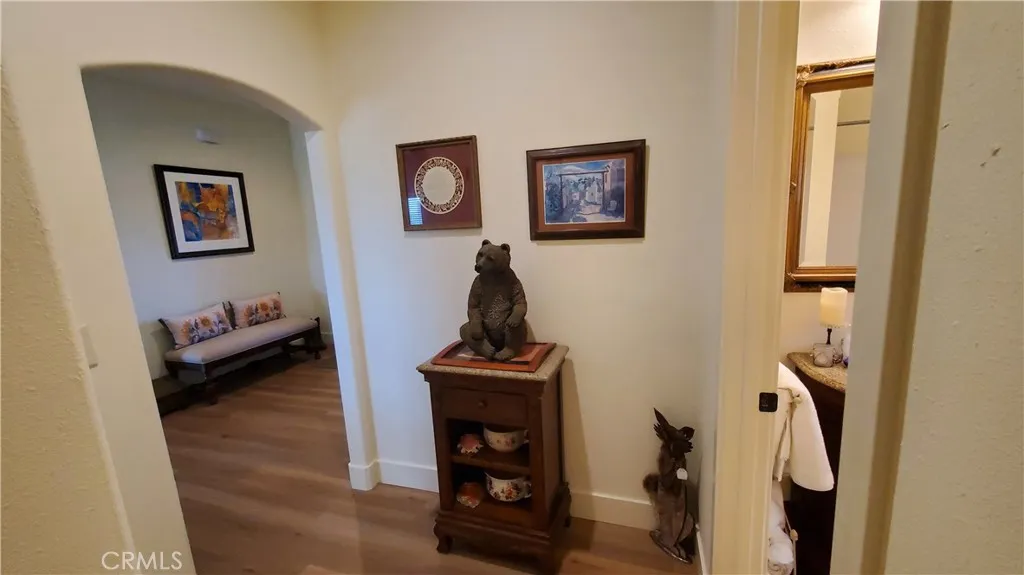 View of hallway leading to guest bathroom and guest bedroom. View of hallway leading to guest bathroom and guest bedroom.