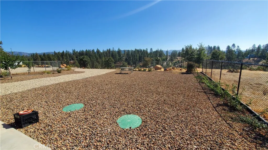 View of fully fenced back yard with views to the East & overlooking Oak Creek Park. View of fully fenced back yard with views to the East & overlooking Oak Creek Park.