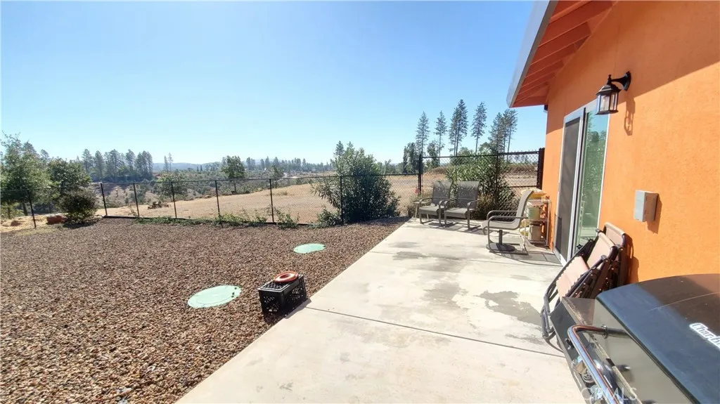 View of open patio area with sliding glass door on the right. This space if set up with an outlet for a hot tub. View of open patio area with sliding glass door on the right. This space if set up with an outlet for a hot tub.
