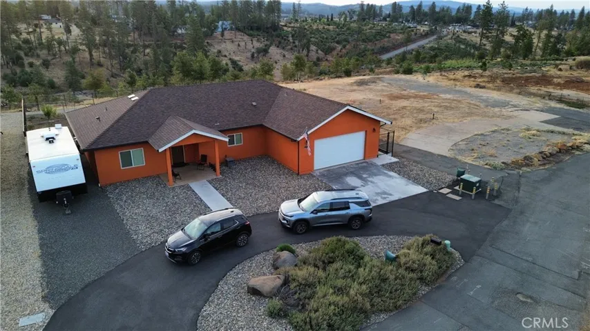 1724 Ellis Drive with circle drive, RV parking & Oak Creek Park located to the rear.