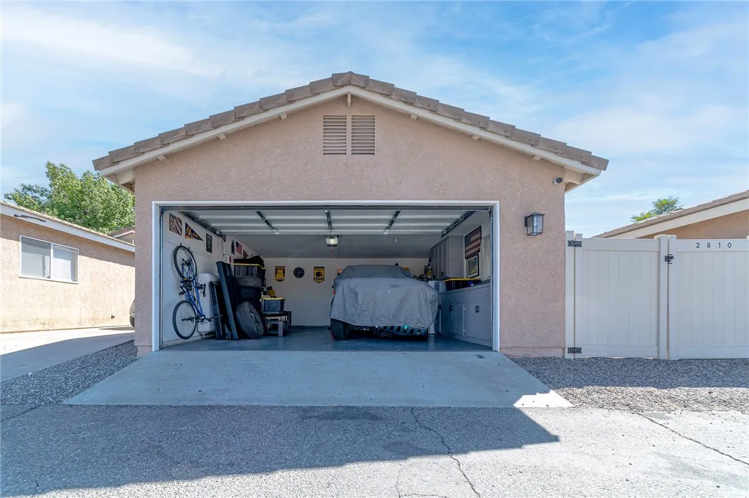 2 car garage and gated parking on the right.