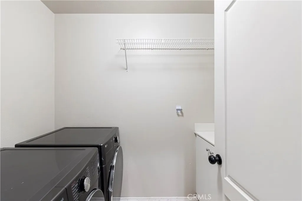 Downstairs inside laundry room w/utility sink and cabinet storage. Downstairs inside laundry room w/utility sink and cabinet storage.