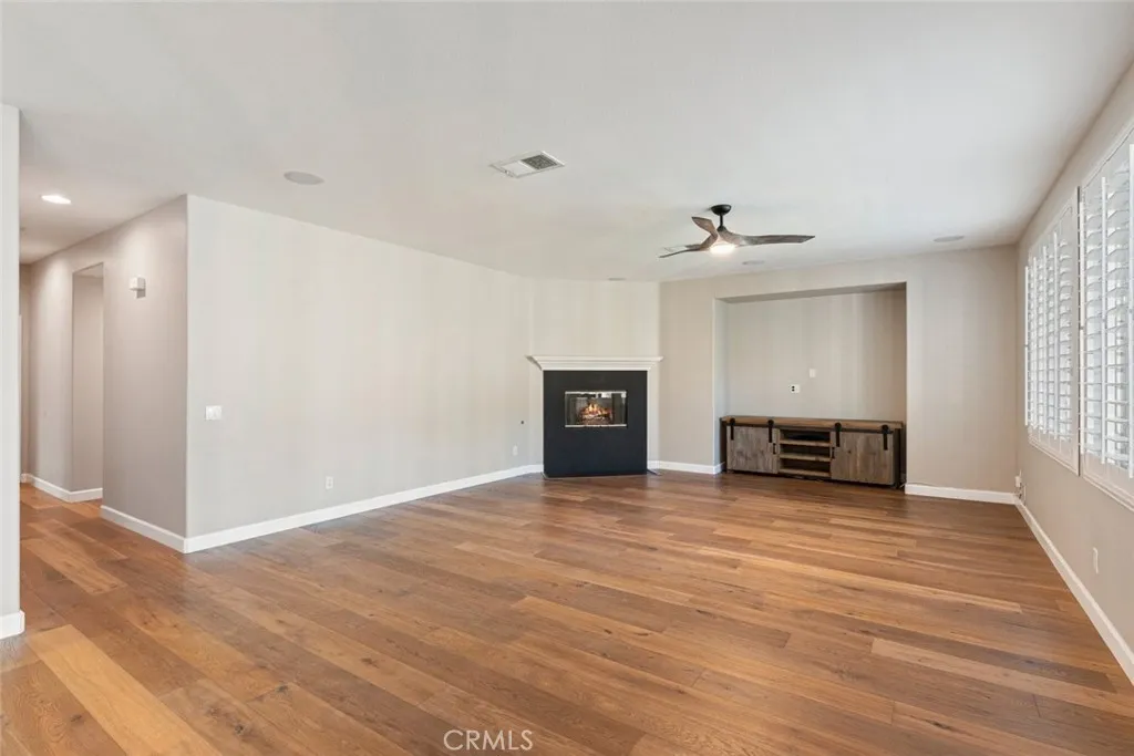 Family room w/fireplace and media niche. Family room w/fireplace and media niche.