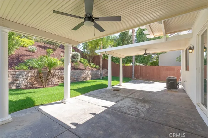 Dual covered patio w/ceiling fans.