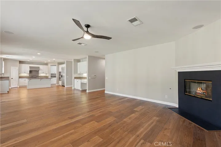 Large open-concept family room connects with kitchen.